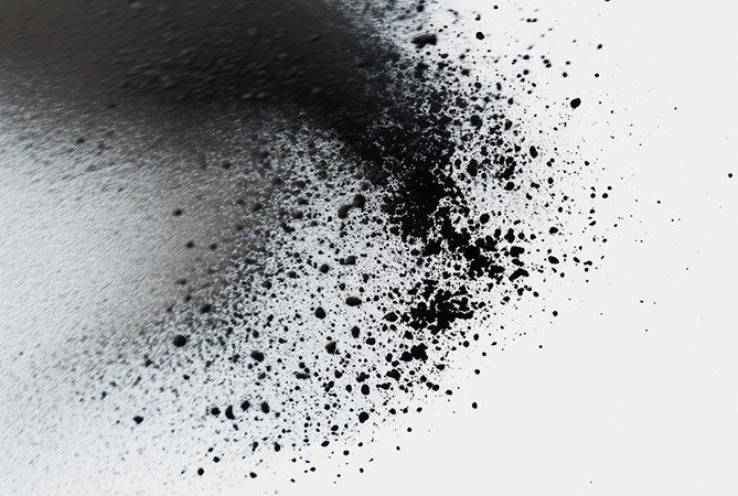 Abstract black ink splatter on white background.